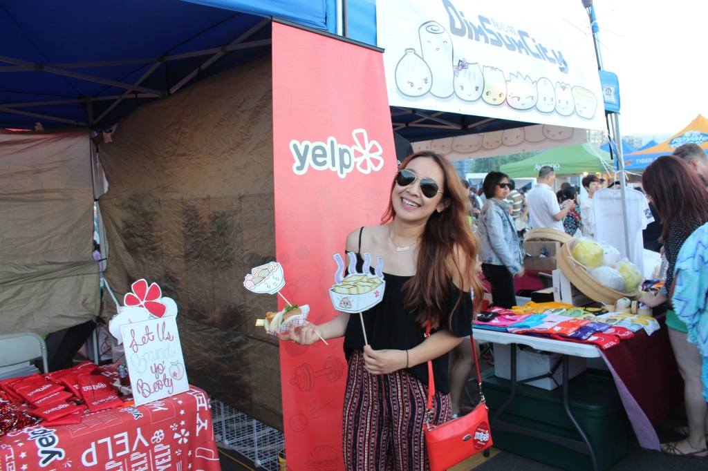 Here's me at the Yelp booth! I checked my location at Night It Up! through their mobile app, we chilled, got free goodies, and took pics with these cute signs the girl working made! 